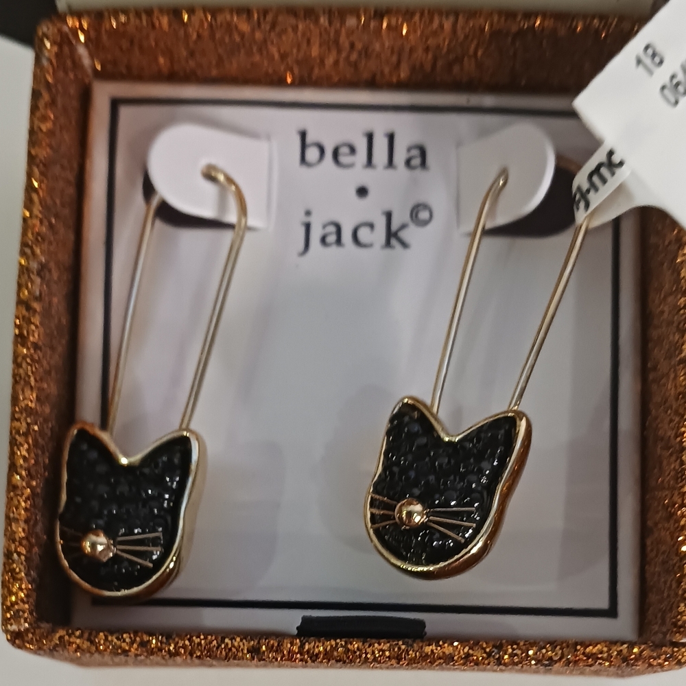 Gold safety pin style earrings with sparkly black cats.
